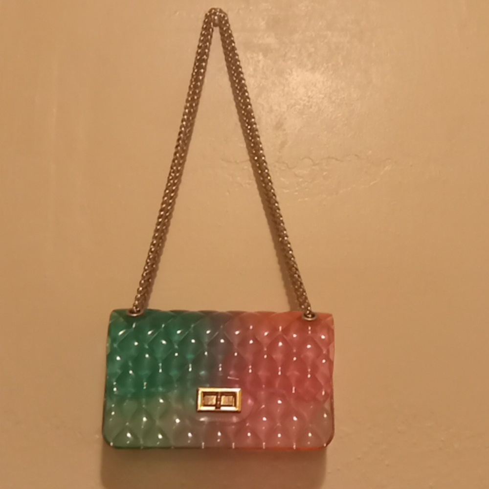 Pink and green shoulder purse.